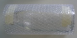 A bottle wrapped in bubble wrap