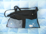 A wide bag with 2 applied front pockets